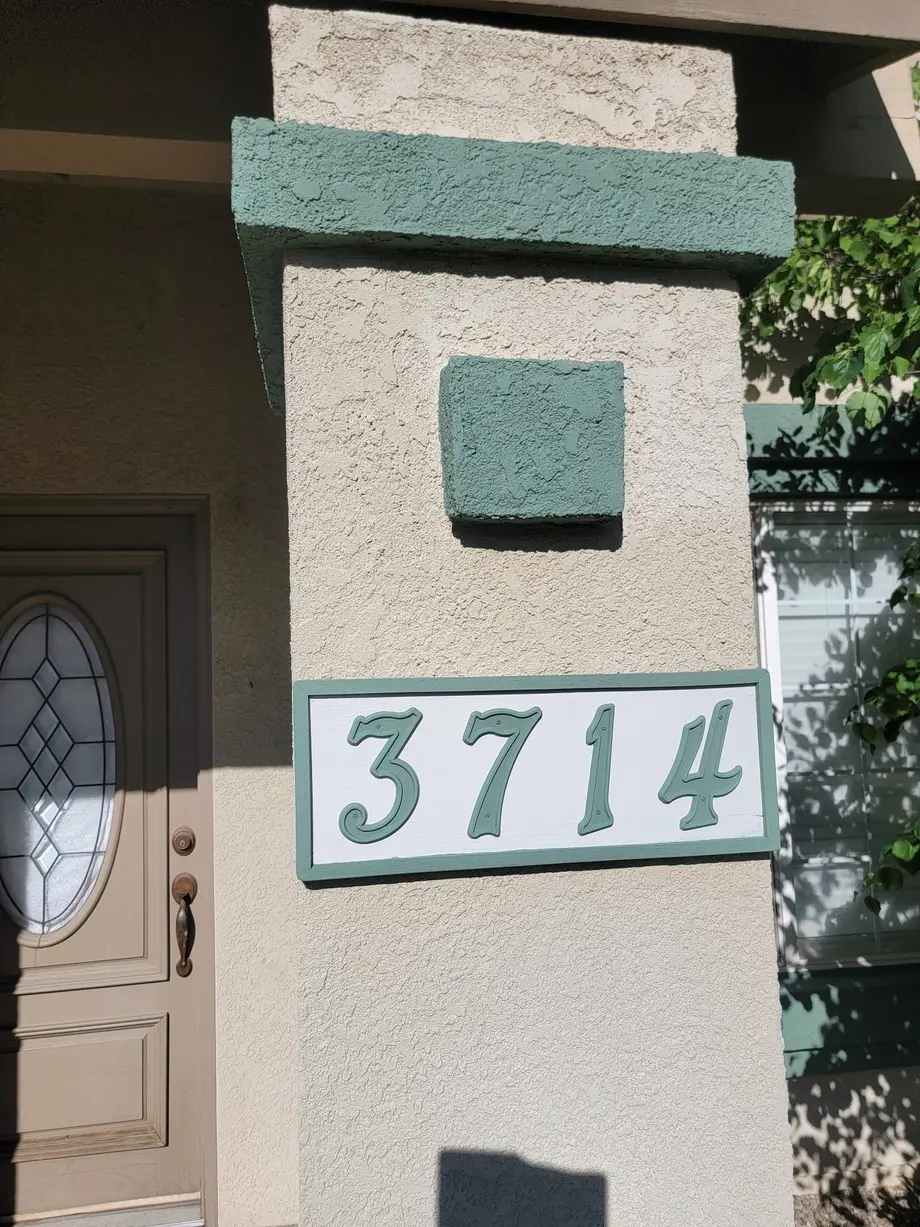 Fresh exterior trim and stucco paint on a Bakersfield home